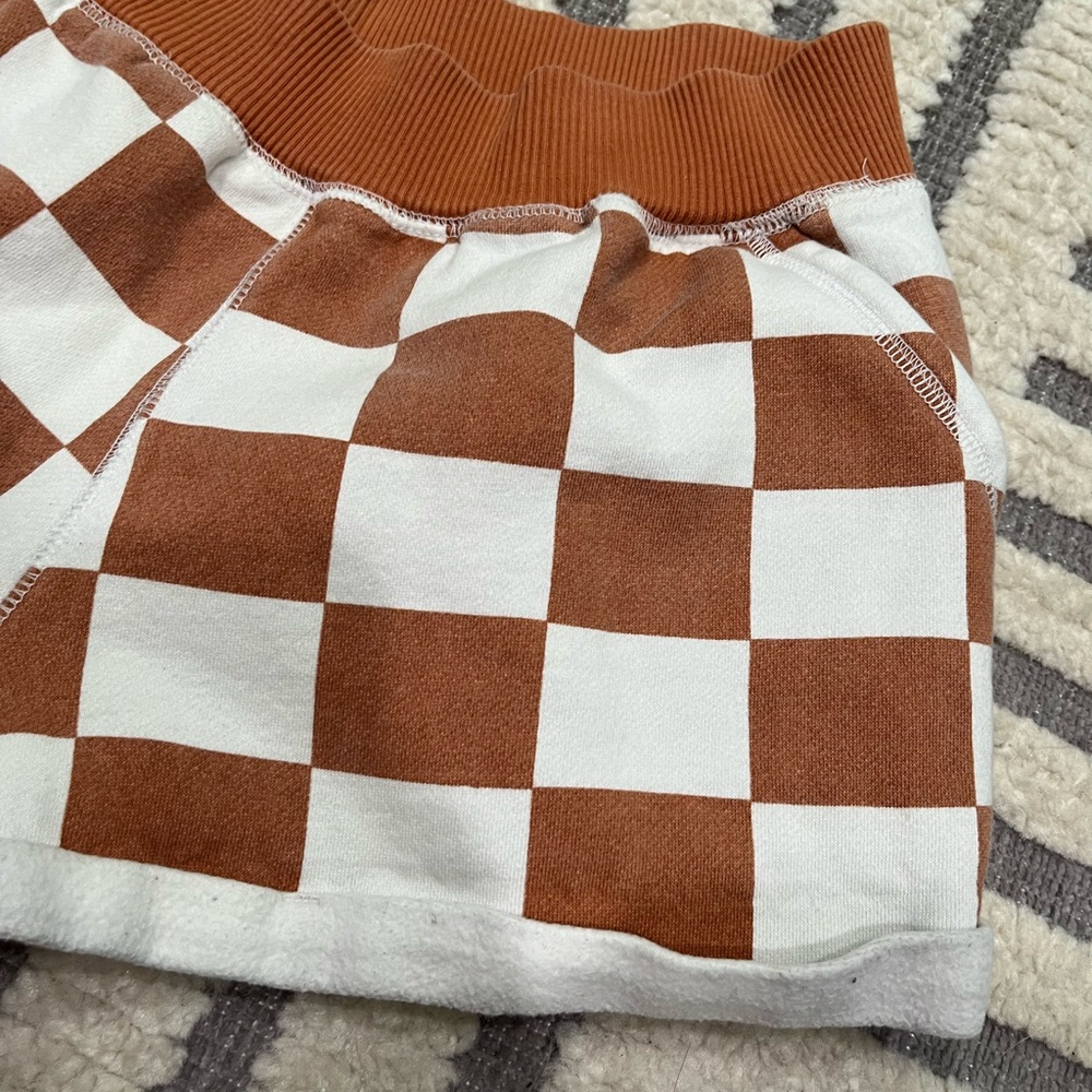Out from under checkered shorts - Picture 4 of 11